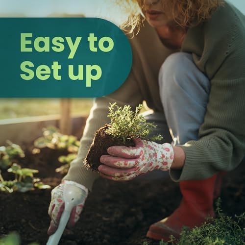 Load image into Gallery viewer, Gardener installing a Blumat moisture meter beside a small plant
