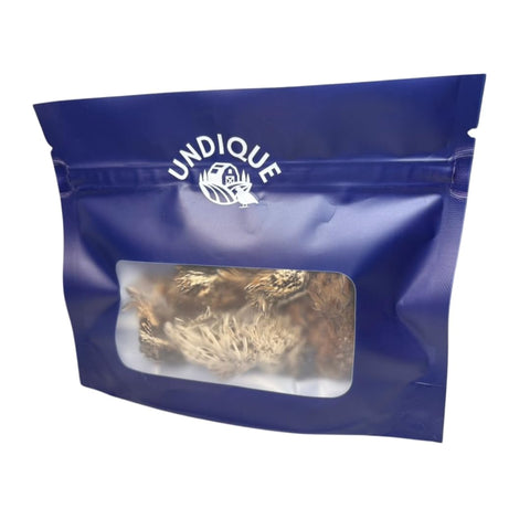 Bag of whole freeze-dried quail head treats for cats, pack of 10.