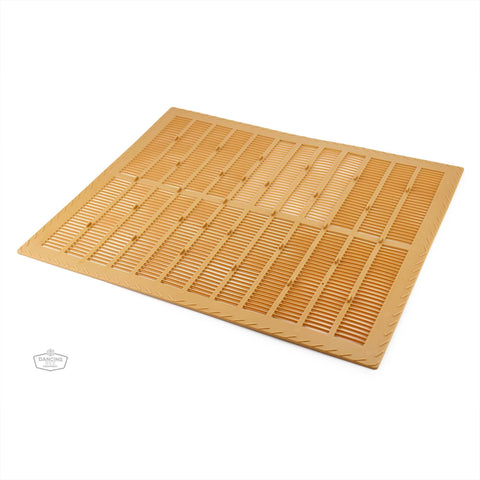 Flexible propolis collector mat placed inside a hive for harvesting propolis.