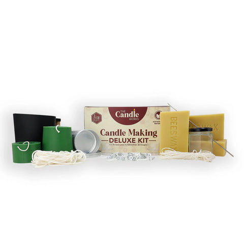 Deluxe candle making kit with expanded wax, molds, wick, and pouring supplies.