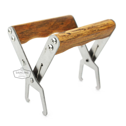 Spring-loaded frame grip with wooden handles for lifting frames from the hive.