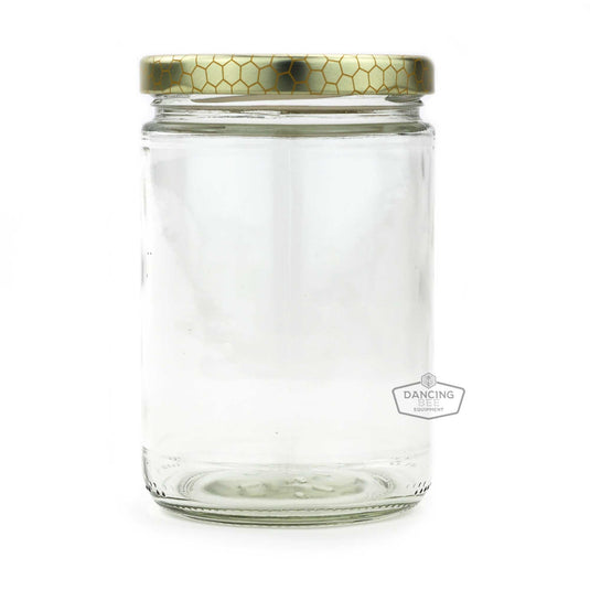 Glass cylinder honey jar with honeycomb-print lid, 350 ml capacity.