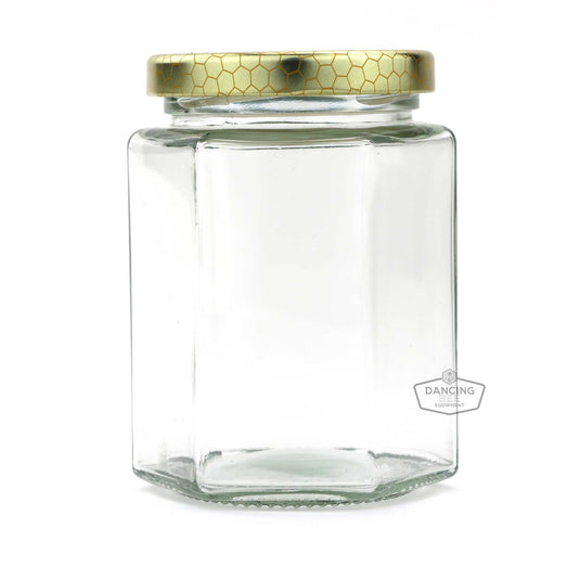 Glass hexagon honey jar with lid, 190 ml / 9 oz capacity.