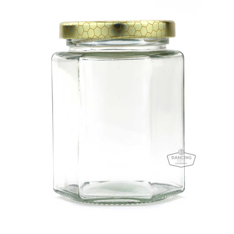 Glass hexagon honey jar with lid, 280 ml / 13.5 oz capacity.