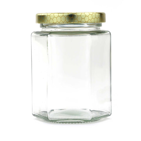 Glass hexagon honey jar with lid, 380 ml / 540 g capacity.