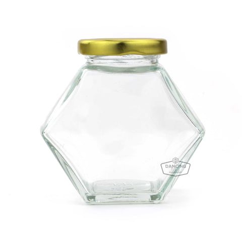 Glass hexagon honey jar with lid, 250 g / 8.5 oz capacity.