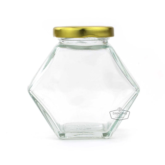 Glass hexagon honey jar with lid, 250 g / 8.5 oz capacity.