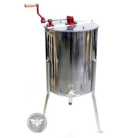 Four-frame manual stainless steel honey extractor with hand crank, front view.