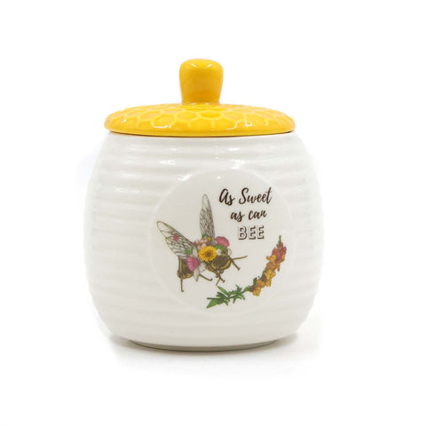 The Bee Works honey pot with lid for pouring and storage.