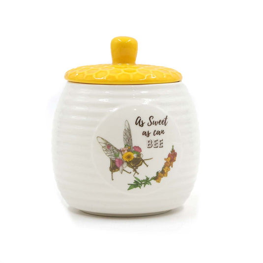 The Bee Works honey pot with lid for pouring and storage.