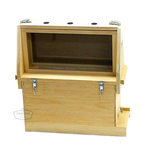 Five-frame observation hive with a shuttered viewing compartment for watching bees.