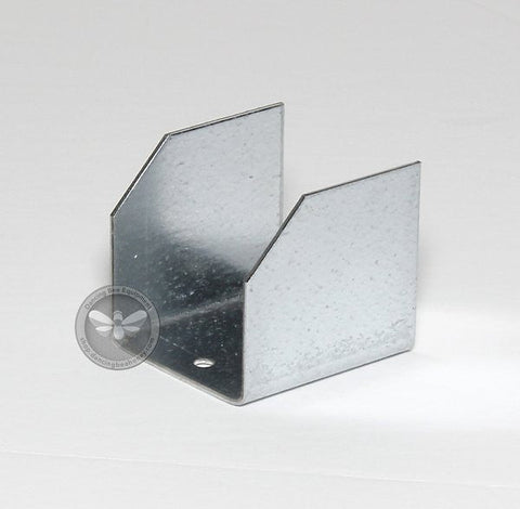 Galvanized steel pallet clips securing hive boxes to a transport pallet.