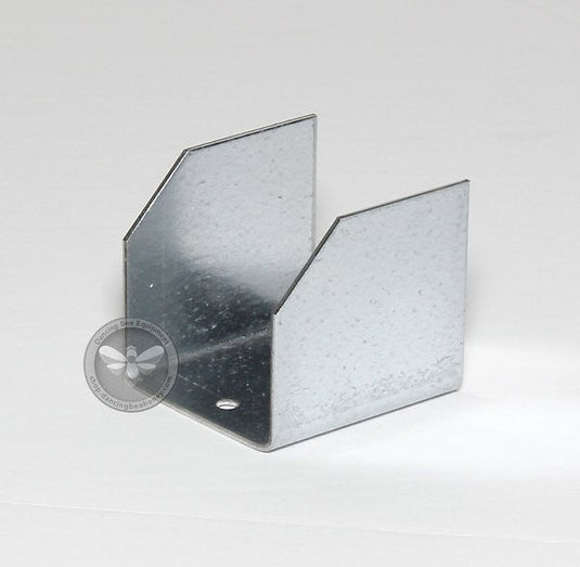 Galvanized steel pallet clips securing hive boxes to a transport pallet.