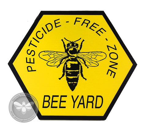 Pesticide-free bee yard sign warning neighbors to avoid spraying near hives.