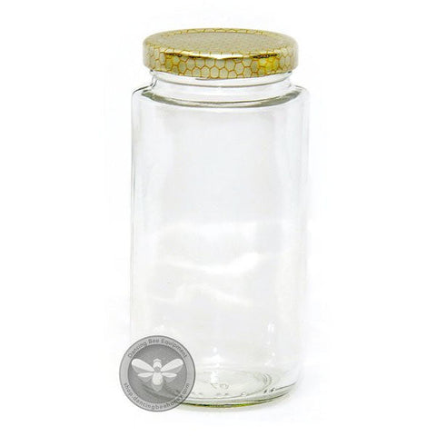Tall slim glass cylinder honey jar with honeycomb-print lid, 375 ml.
