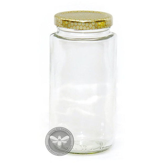 Tall slim glass cylinder honey jar with honeycomb-print lid, 375 ml.