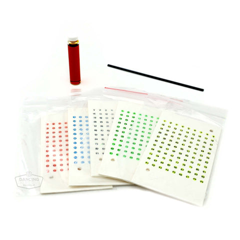 Queen bee marking kit with numbered discs, glue, and placement tool.