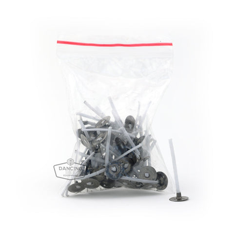 Pack of 50 pre-wicked candle tabs with attached cotton wicks.