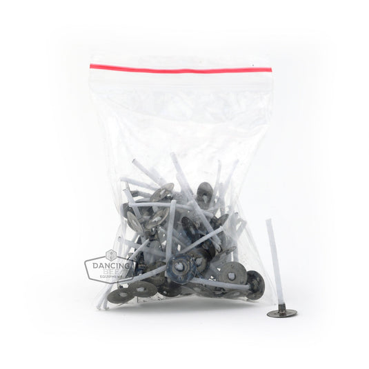 Pack of 50 pre-wicked candle tabs with attached cotton wicks.