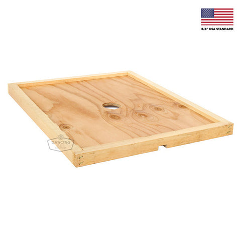 Fully assembled inner cover with a notched ventilation rim for a Langstroth hive.