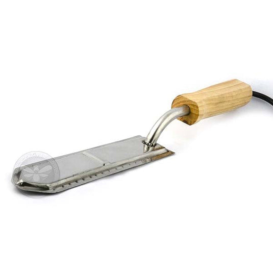 Heated electric uncapping knife for cutting through honey frame wax cappings.