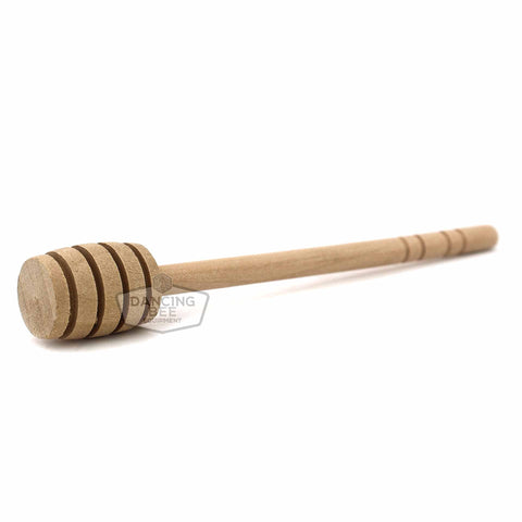 Classic 6-inch wooden honey dipper with deep grooves for drizzling honey.